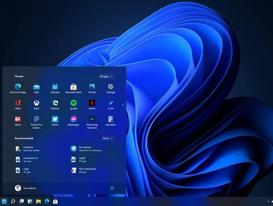 Capture d'écran de Windows 11 avec le menu Démarrer ouvert, applications épinglées et fond bleu ; barre des tâches centrée.