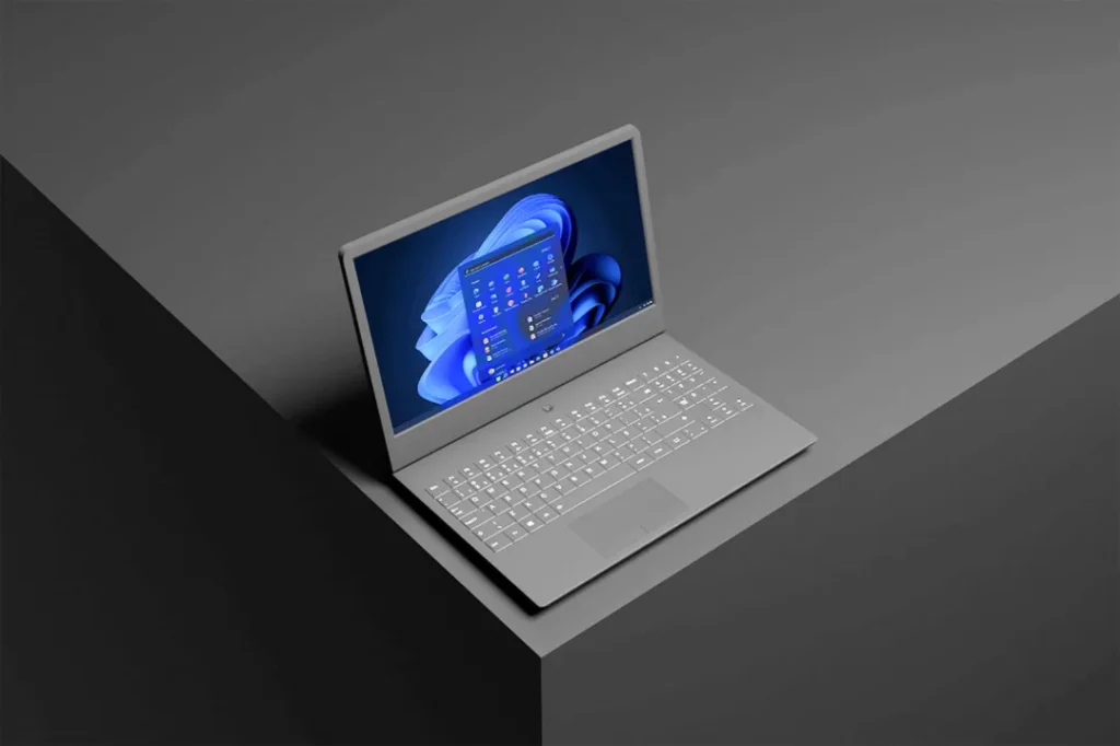 Windows 11 Home sur un ordinateur portable en mode sombre avec une interface moderne et minimaliste