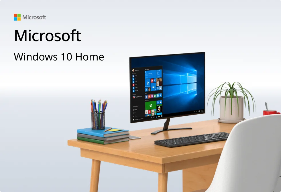 Bureau moderne avec ordinateur affichant Windows 10 Home, clavier, souris, livres, stylos et plante ; logo Microsoft visible.