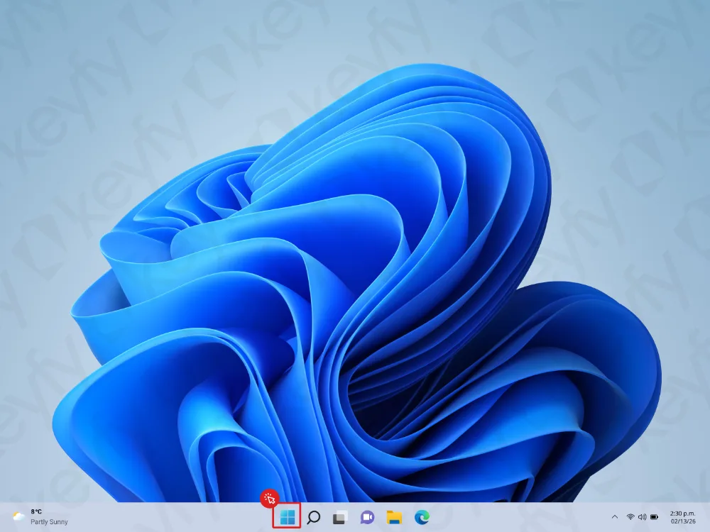 Un écran de bureau Windows 11 avec l'icône du menu Démarrer mise en évidence en rouge dans la barre des tâches en bas. L'arrière-plan présente un fond d'écran abstrait bleu. L'heure affichée est 14h39.